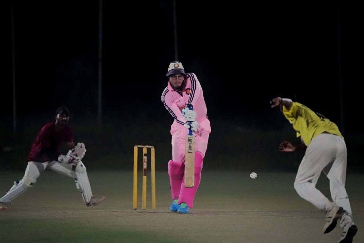 Day-night club cricket match in India, batsman driving under lights